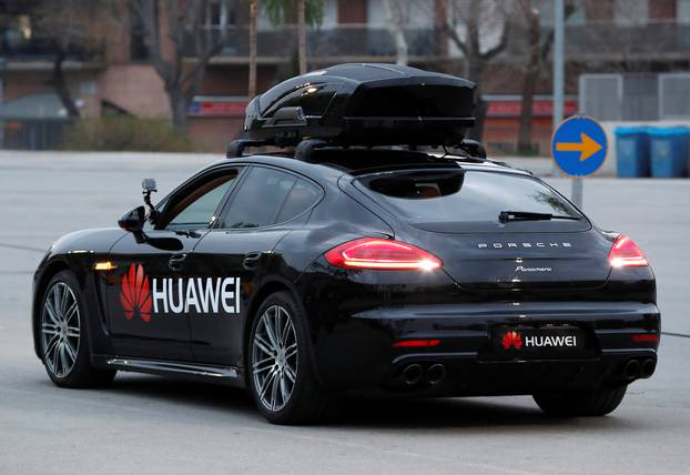 A driverless car controlled by a Huawei Mate 10 Pro mobile is pictured during the Mobile World Congress in Barcelona