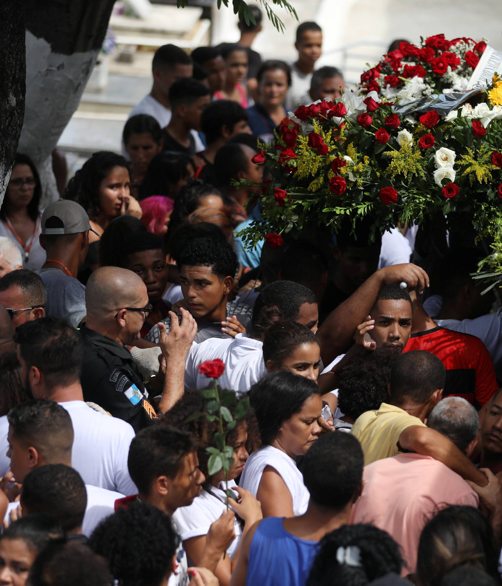 Relatives and friends of teenage soccer player Samuel Thomas de Souza Rosa, who died in the fire that swept through Flamengo's training ground attend his burial, in Rio de Janeiro