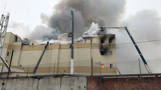 Firefighters extinguish a fire at a shopping mall in Kemerovo