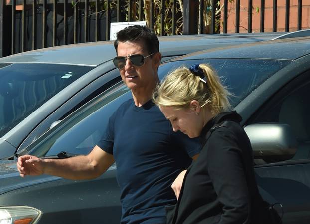 EXCLUSIVE: Tom Cruise is spotted heading to the studio with a female companion in Los Angeles.