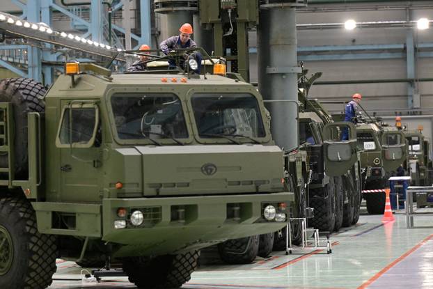 FILE PHOTO: Russian President Vladimir Putin visits a plant belonging to missile manufacturer Almaz-Antey in St Petersburg
