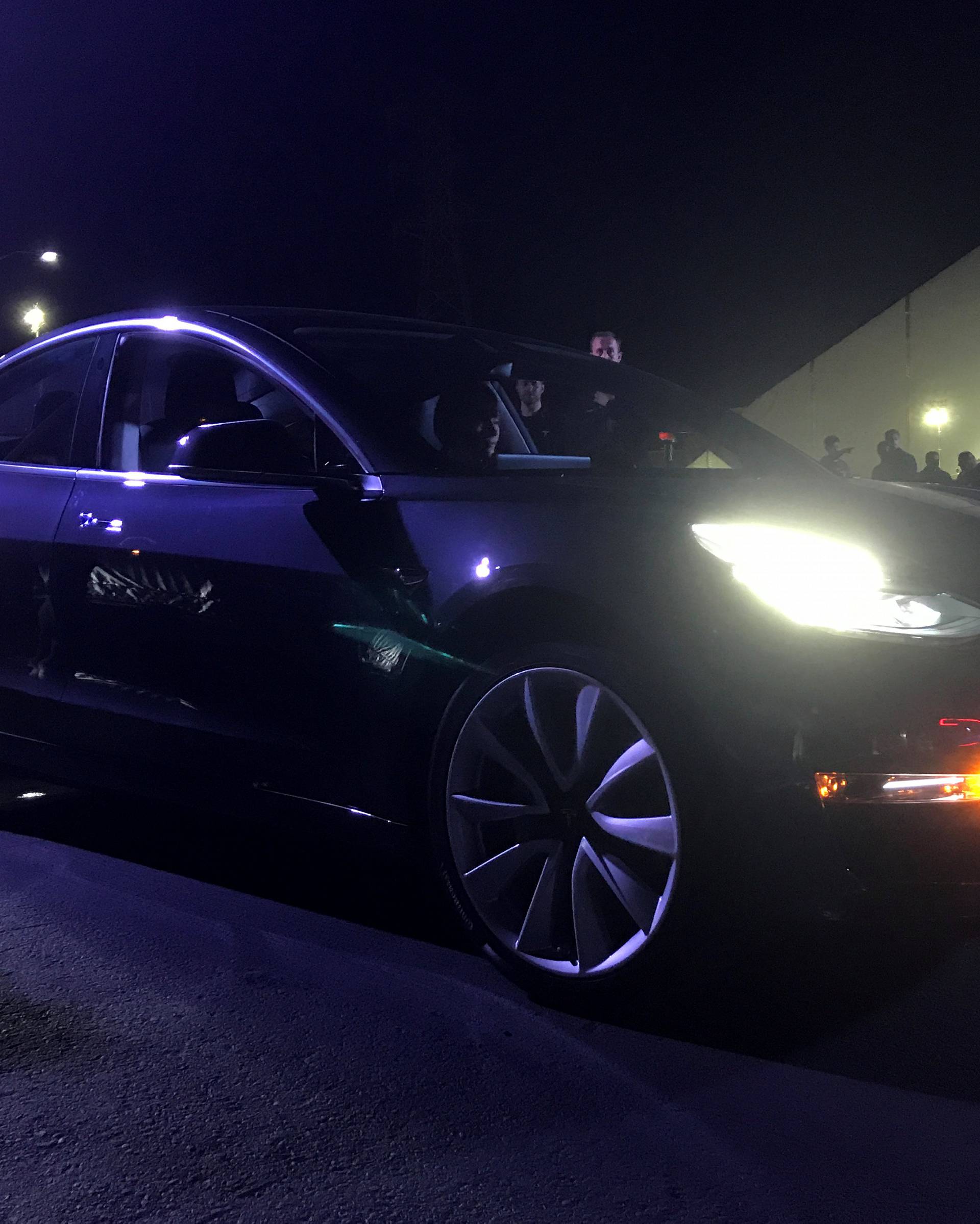 Customer employees receive some of the first Model 3 cars off the Fremont factory's production line during an event at the company's facilities in Fremont, California,