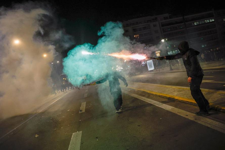 Protesters clash with police during a demonstration after a train crash near the city of Larissa, in Athens