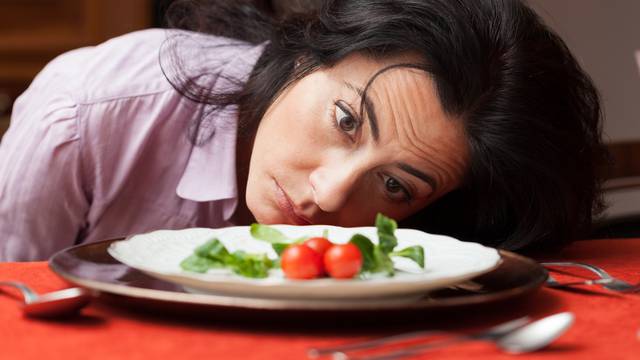 Woman,Looking,To,A,Little,Salad,Is,Tired,About,Diet.