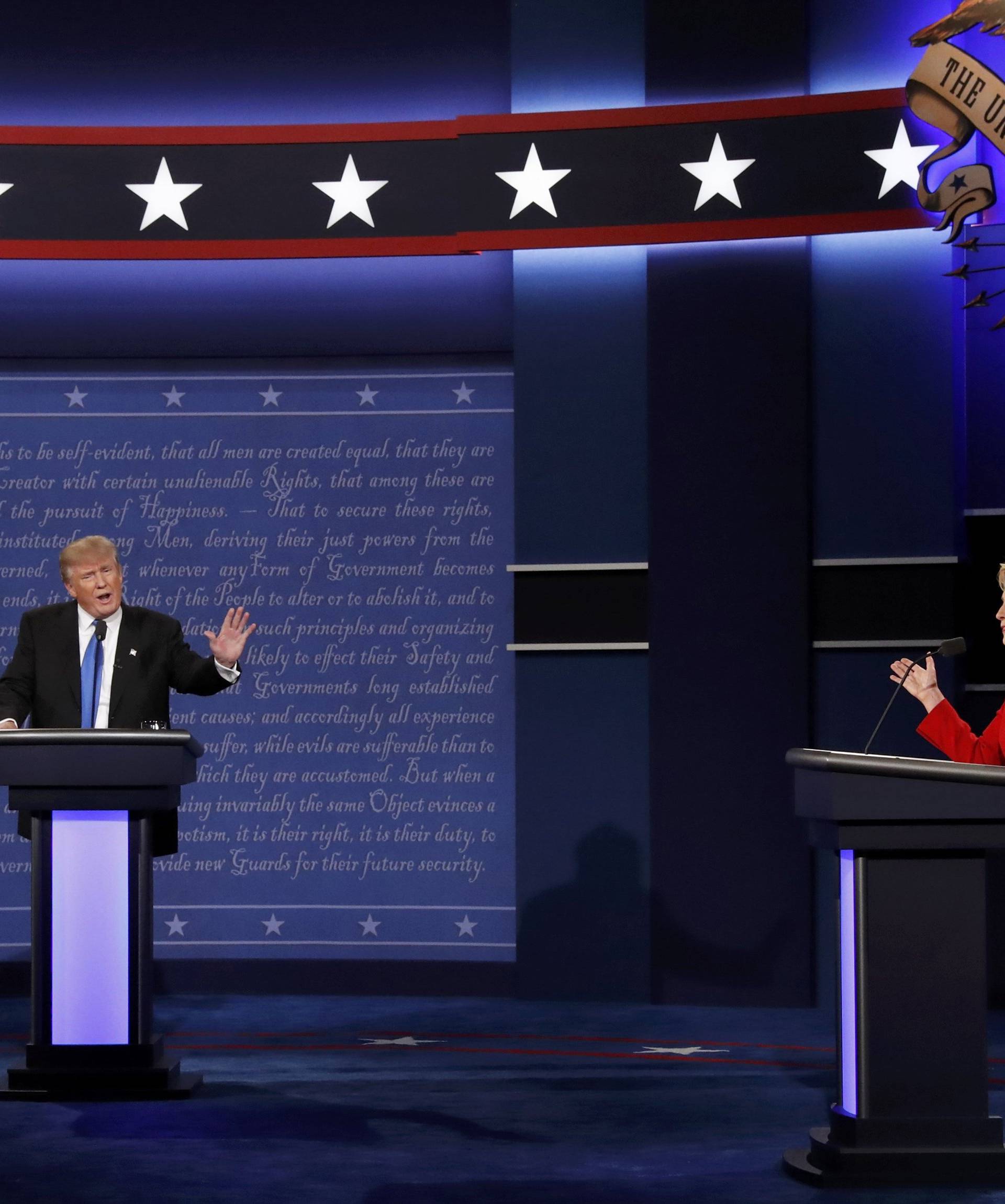 Republican U.S. presidential nominee Donald Trump and Democratic U.S. presidential nominee Hillary Clinton discuss a point during their first presidential debate at Hofstra University in Hempstead