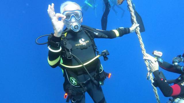 Ray Woolley, diver and World War Two veteran, is seen underwater during an attempt to break a new diving record as he turns 96 by taking the plunge at the Zenobia, a cargo ship wreck off the Cypriot town of Larnaca