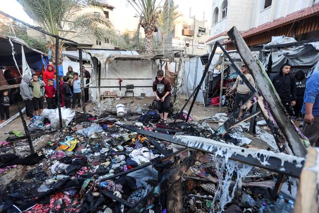 Aftermath of an Israeli strike on tents of displaced people, in Deir Al-Balah