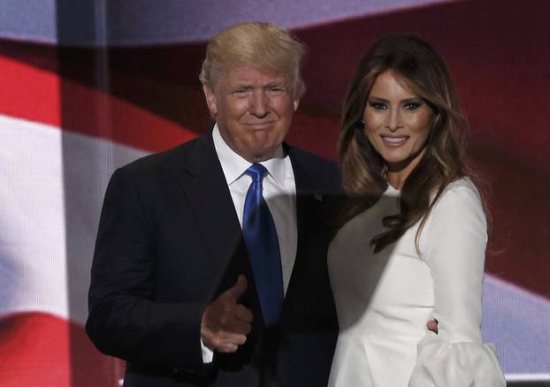 Republican U.S. presidential candidate Donald Trump gives a thumbs up with his wife Melania after she concluded her remarks at the Republican National Convention in Cleveland