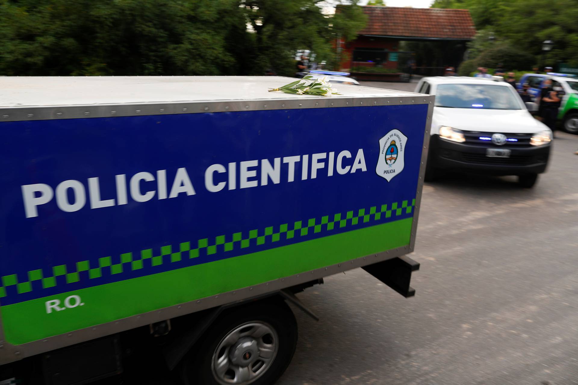 A scientific police vehicle carrying the body of Argentine great Diego Maradona leaves the house where he was staying