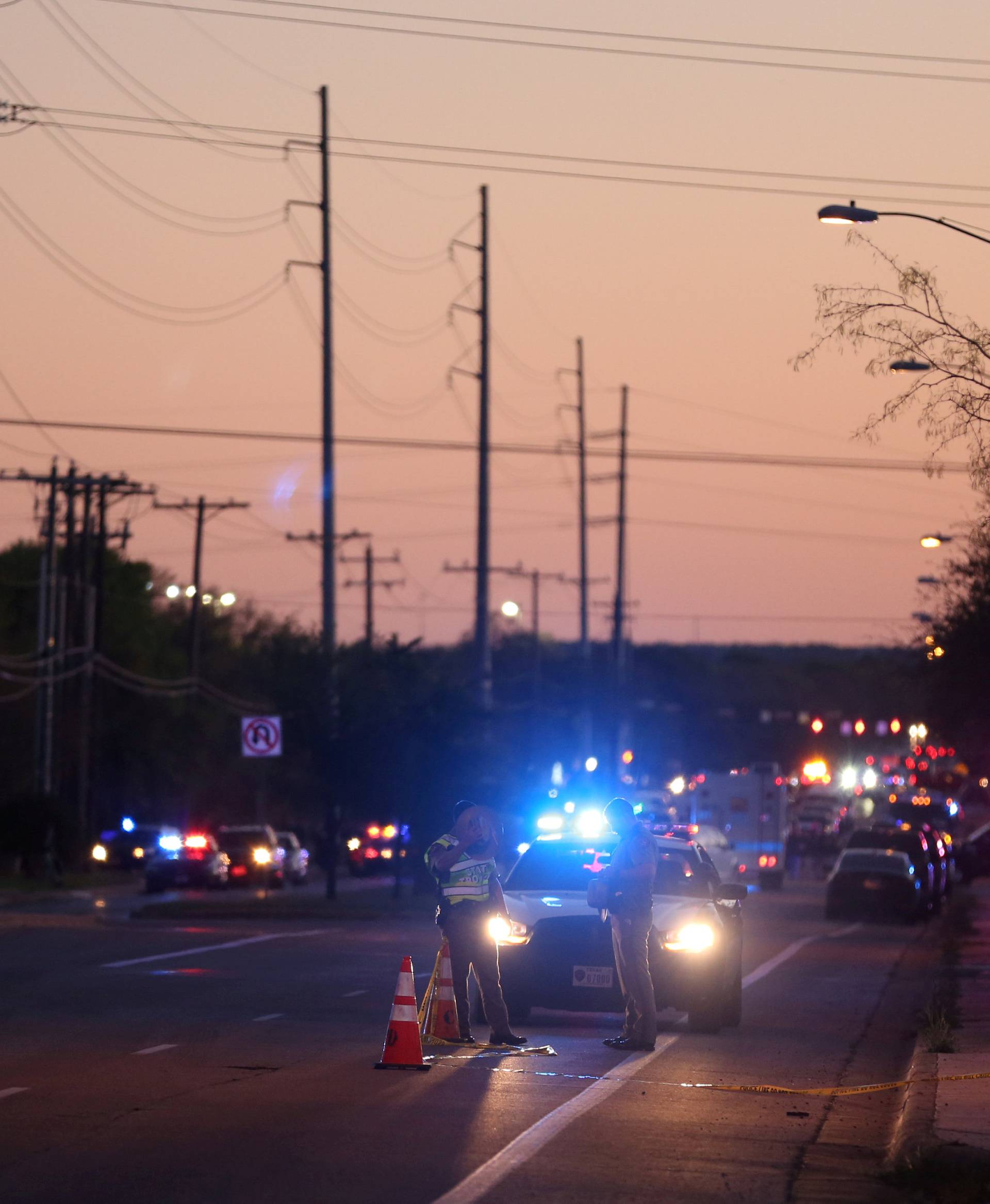 Law enforcement personnel investigate an incident  in Austin