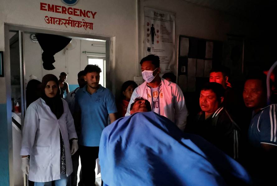 An injured man at a hospital for treatment following a flash flood at Trishuli, Nepal
