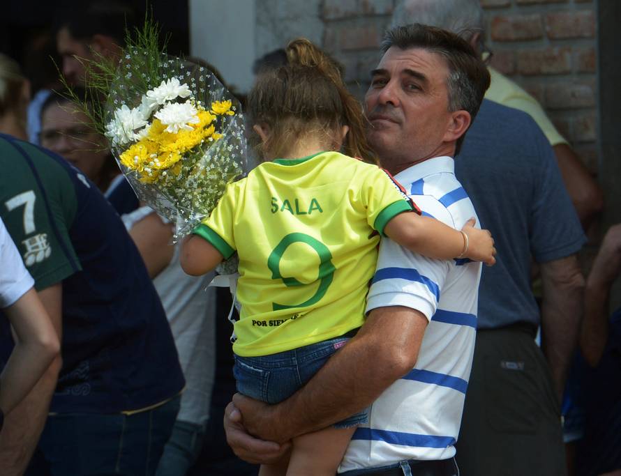 A girl wearing Emiliano Sala's jersey, former striker of French club Nantes, who died in a plane crash in the English Channel, attends his wake in Progreso