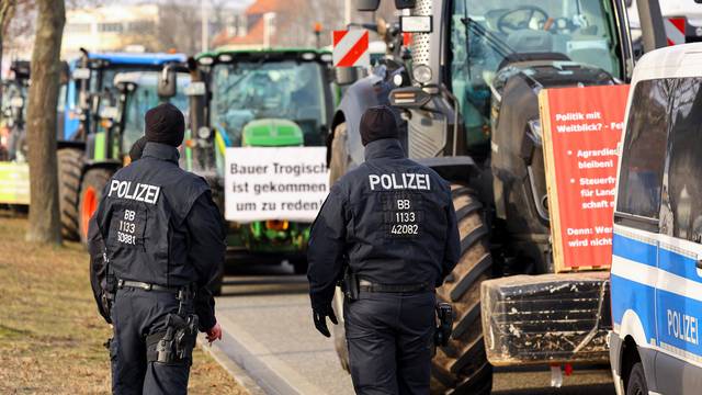 German farmers take part in a protest against the cut of vehicle tax subsidies of the so-called German Ampel coalition government, in Cottbus