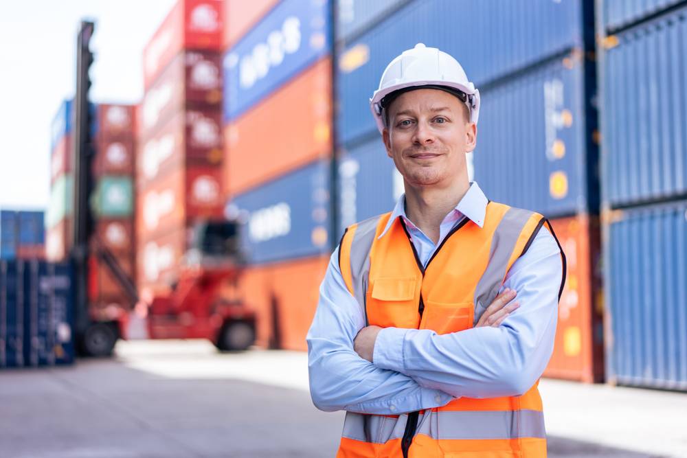 Portrait,Of,Caucasian,Engineer,Worker,Work,In,Container,Port,Terminal.