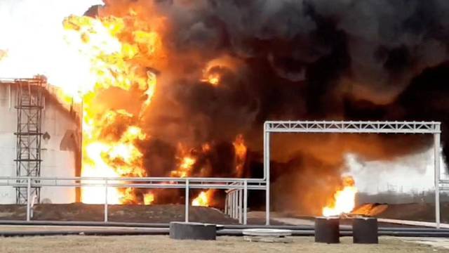 A still image shows a fuel depot on fire in Belgorod