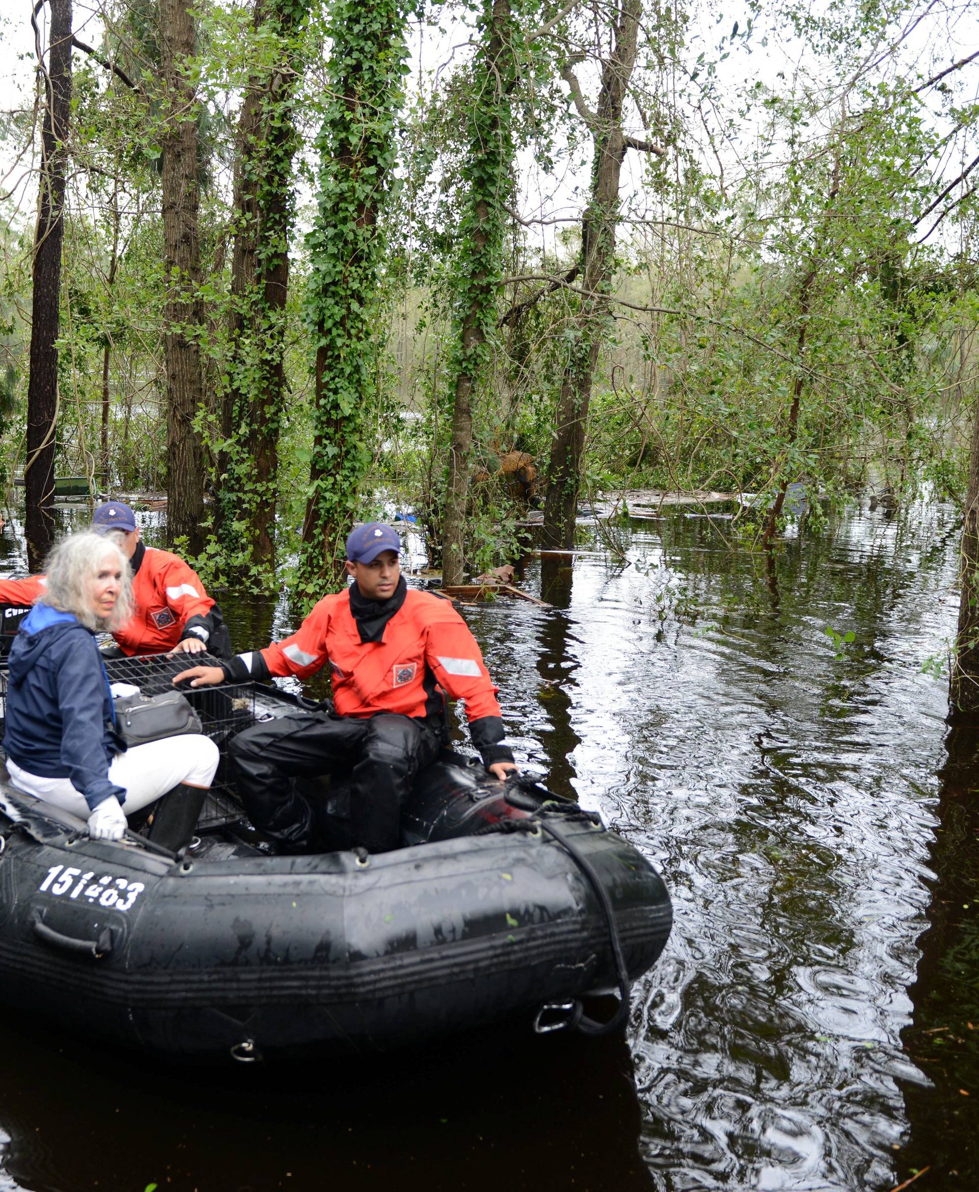 An elderly woman and her husband along with their pets are rescued by U.S. Coast Guard after their home was flooded by Hurricane Florence, in Brunswick County, North Carolina