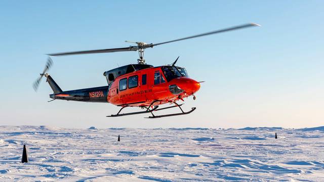 A Bell 212 helicopter lands at Ice Camp Whale during Operation Ice Camp (ICE CAMP) 2024