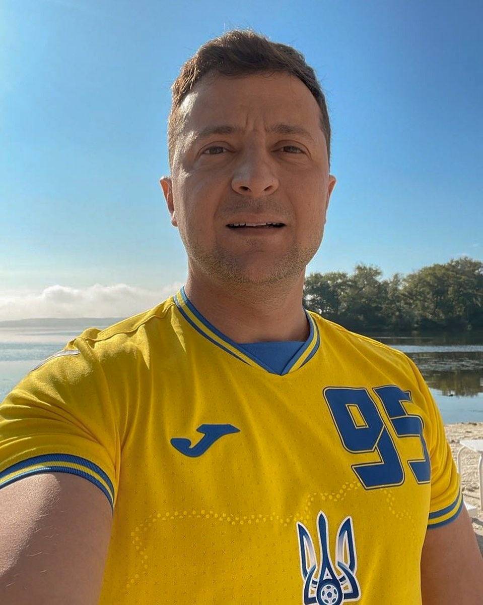 FILE PHOTO: Ukrainian President Volodymyr Zelenskiy poses in Ukraine soccer kit