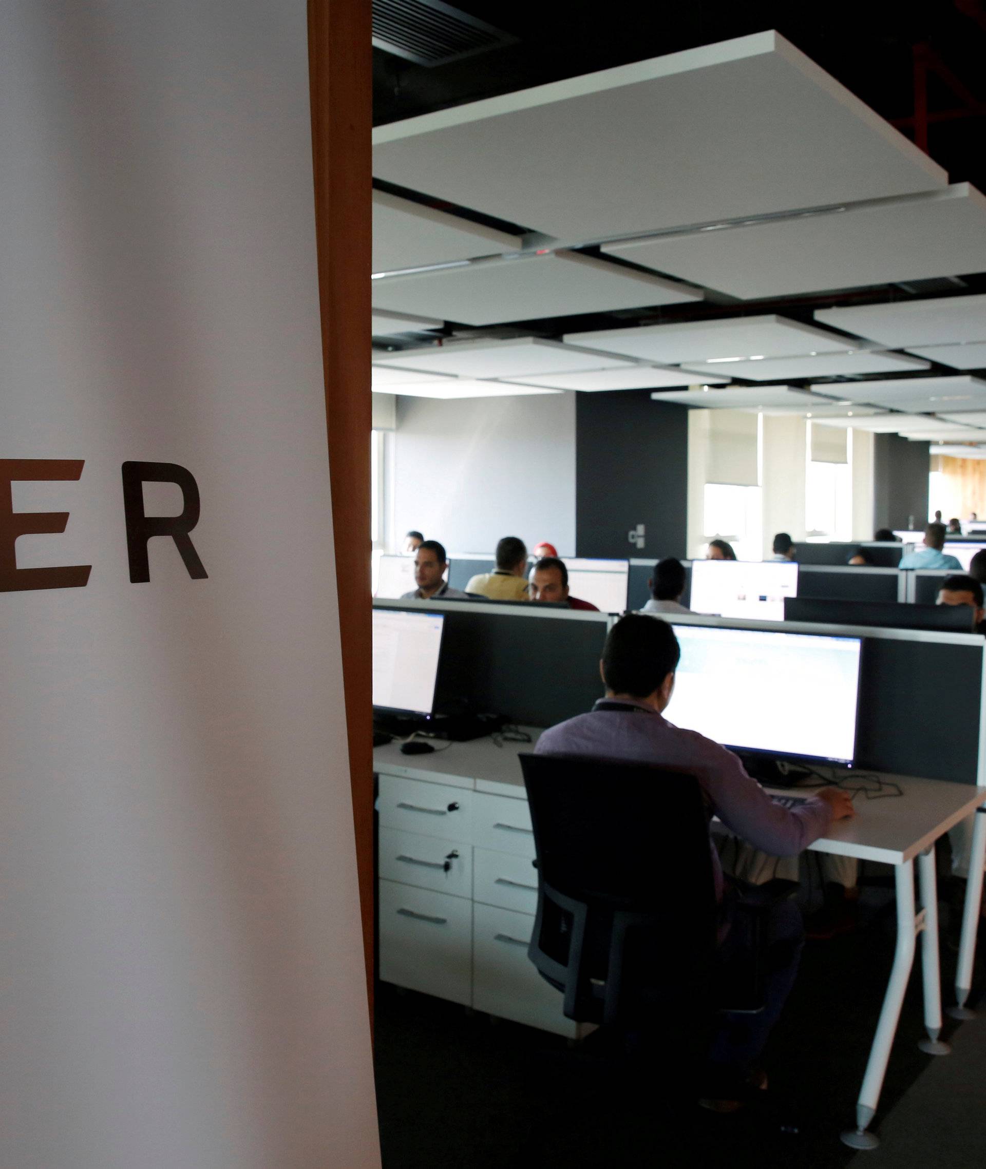 FILE PHOTO: Employees work inside Uber COE in Cairo
