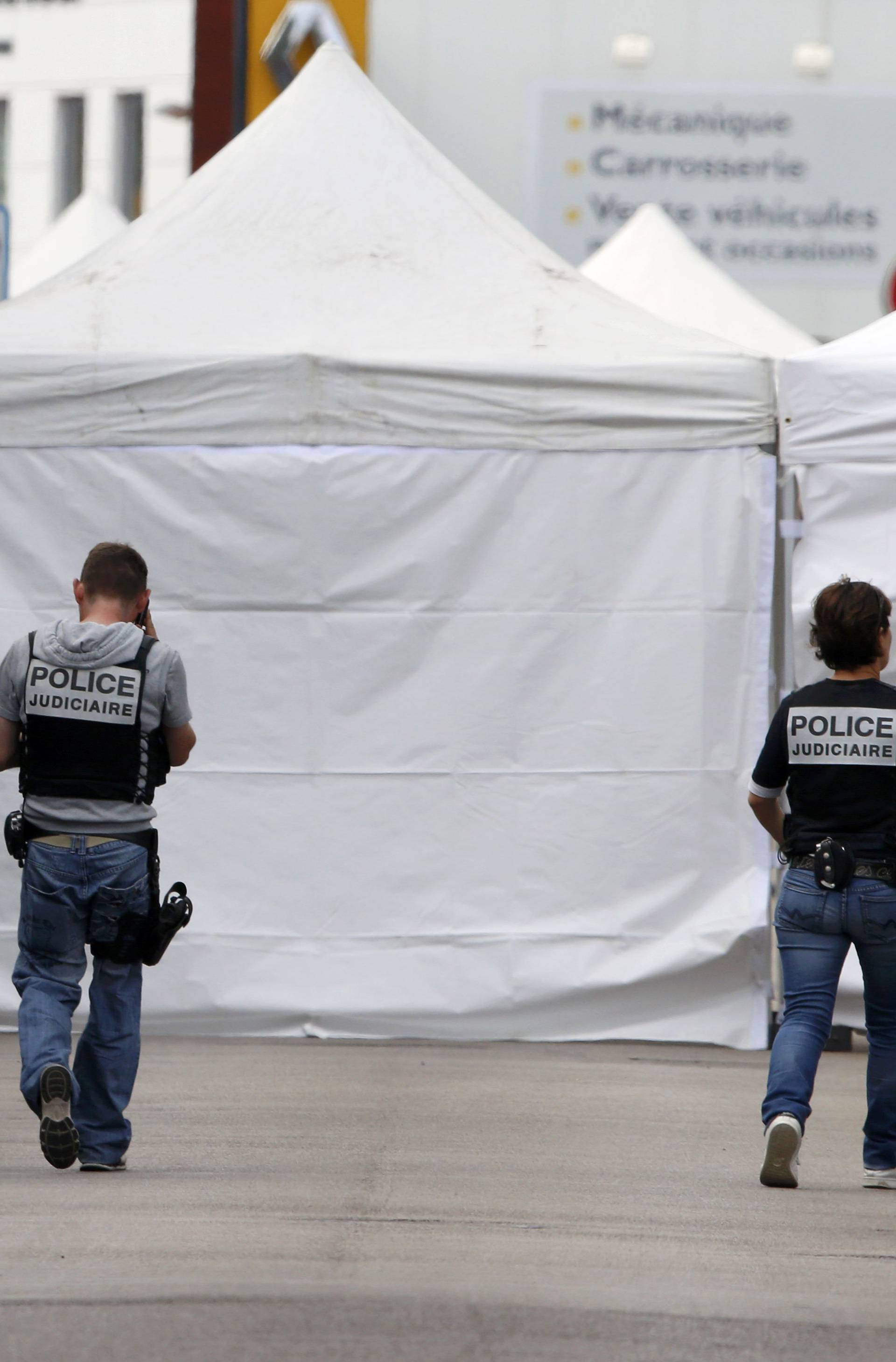  French police work near tents as the investigation continues near the church in Saint-Etienne-du-Rouvray near Rouen 
