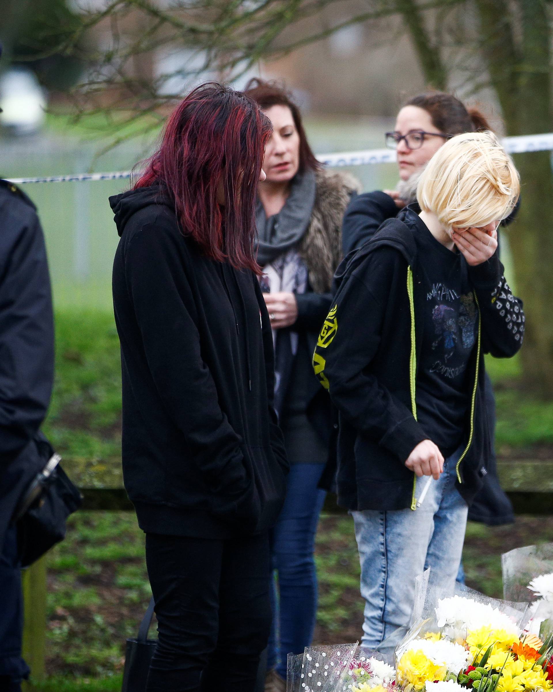 People visit  a site near to where 17-year-old Jodie Chesney was killed, at the Saint Neots Play Park in Harold Hill, east London