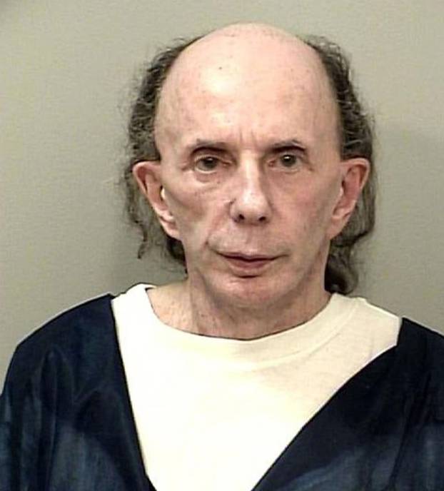Phil Spector is completely bald and grinning in new jail house mugshot
