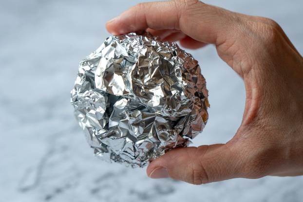 Wrinkled,Ball,Of,Aluminium,Foil,,A,Material,Often,Used,In