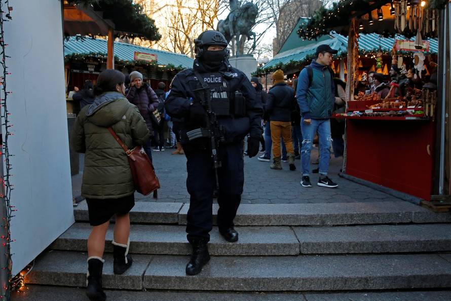 A member of the New York Police Department's Counterterrorism Bureau patrols the Union Square Holiday market following the Berlin Christmas market attacks in Manhattan, New York City, U.S.