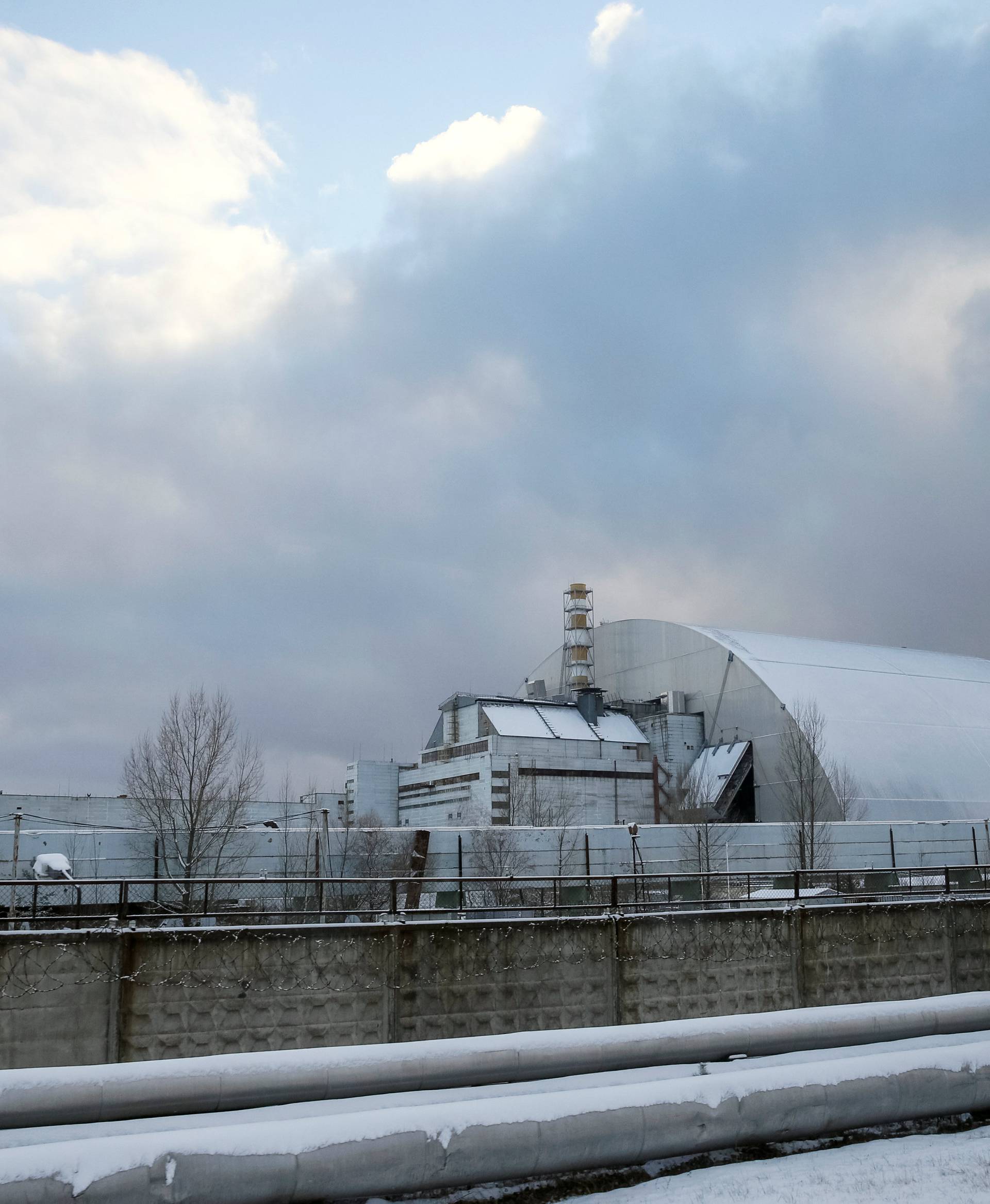 A general view shows a New Safe Confinement structure over the old sarcophagus covering the damaged fourth reactor at the Chernobyl nuclear power plant, in Chernobyl