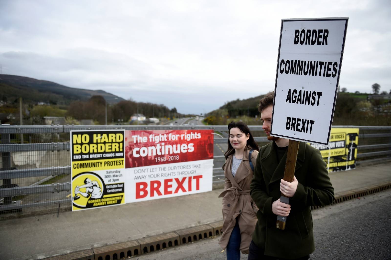 FILE PHOTO: People attend a protest against Brexit at the border crossing between the Republic of Ireland and Northern Ireland in Carrickcarnon