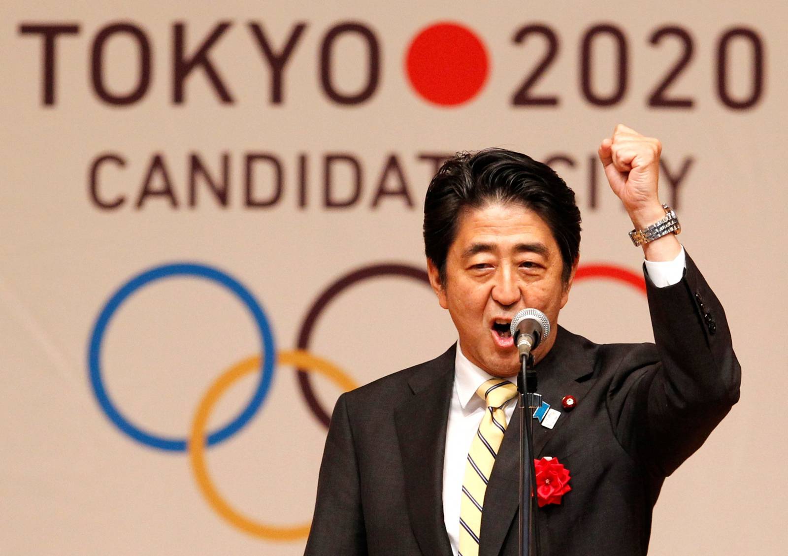 FILE PHOTO: Japan's Prime Minister Shinzo Abe gestures as he speaks during Tokyo 2020 kick off rally in Tokyo