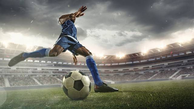 Professional,Football,Or,Soccer,Player,In,Action,On,Stadium,With