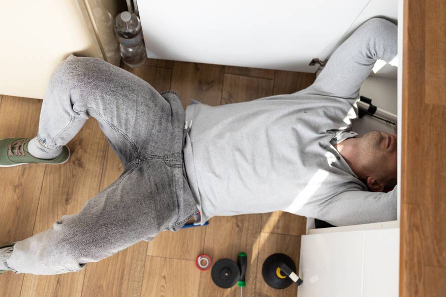 Professional,Plumber,Fixing,Broken,Water,Tap,In,Kitchen.,Repair,Service