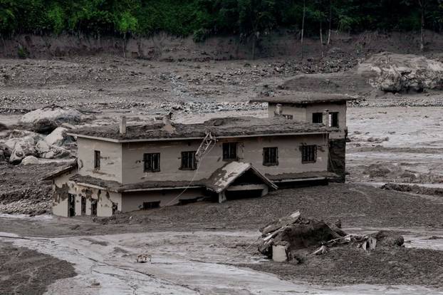 Mud covers a property following a flash flood at Trishuli, Nepal