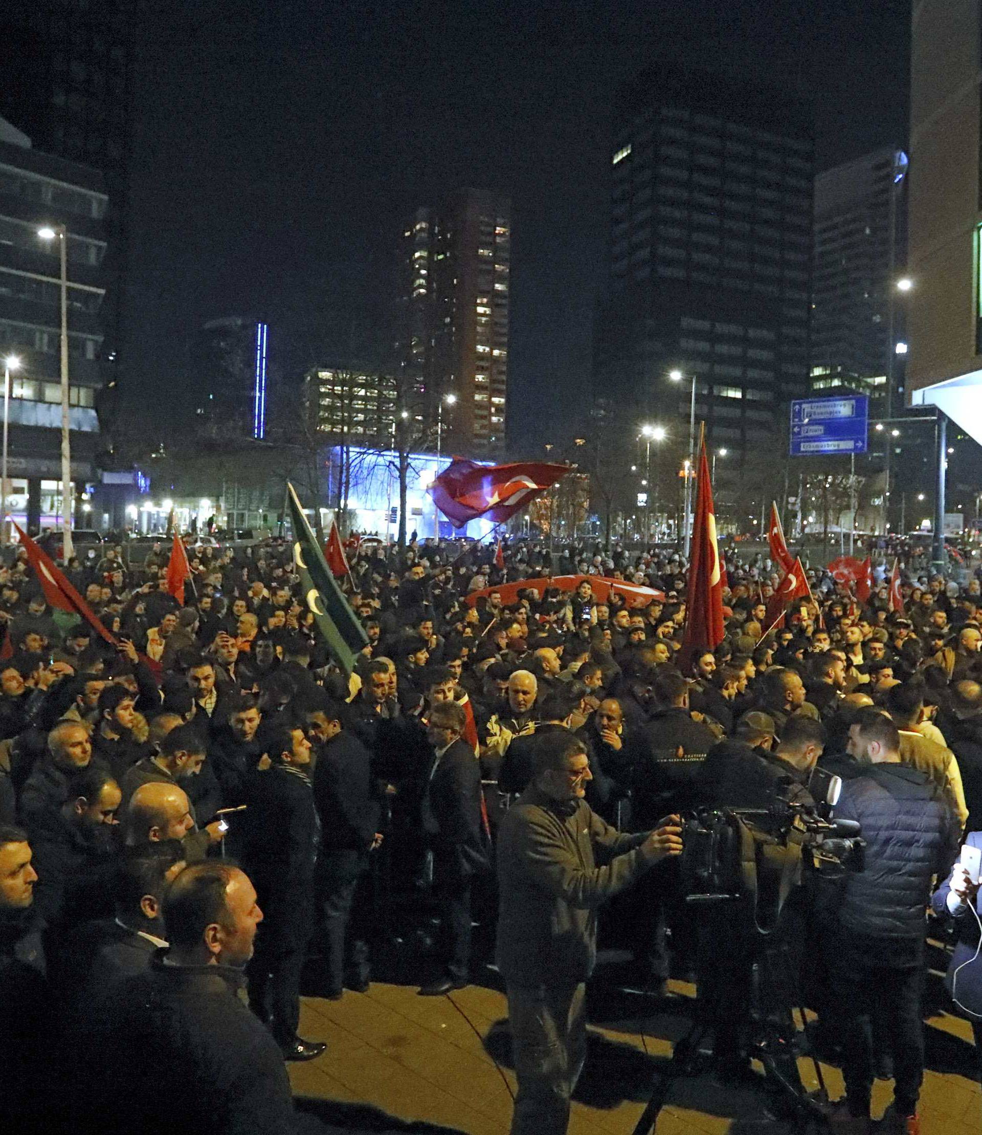 A crowd gathers outside the Turkish consulate in Rotterdam where Turkish minister Kaya is expected