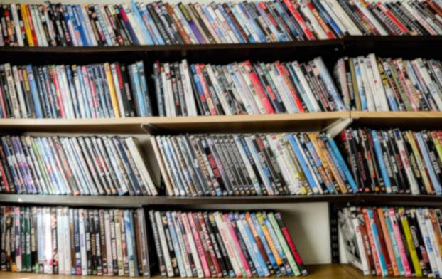 Blur,Photo,,Collection,Of,Movies,,Shelf,Full,Of,Dvd.