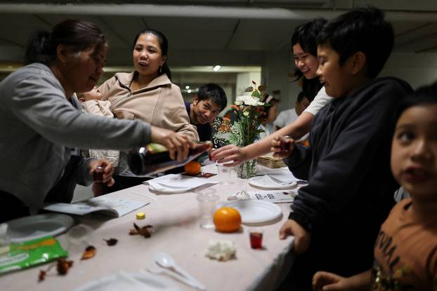 Israelis hold a Passover Seder in an underground parking garage used as a public bomb shelter, in Tel Aviv