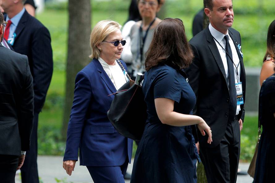 U.S. Democratic presidential candidate Hillary Clinton arrives for ceremonies to mark the 15th anniversary of the September 11 attacks at the National 9/11 Memorial in New York