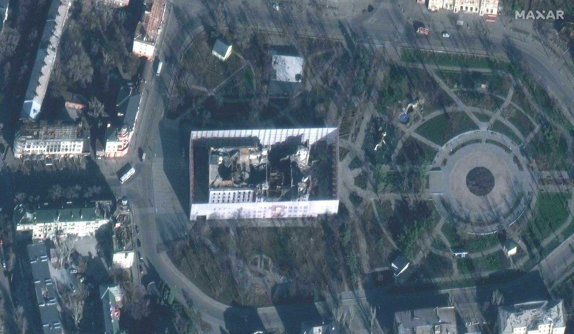 A satellite image shows a screen around a theater in Mariupol