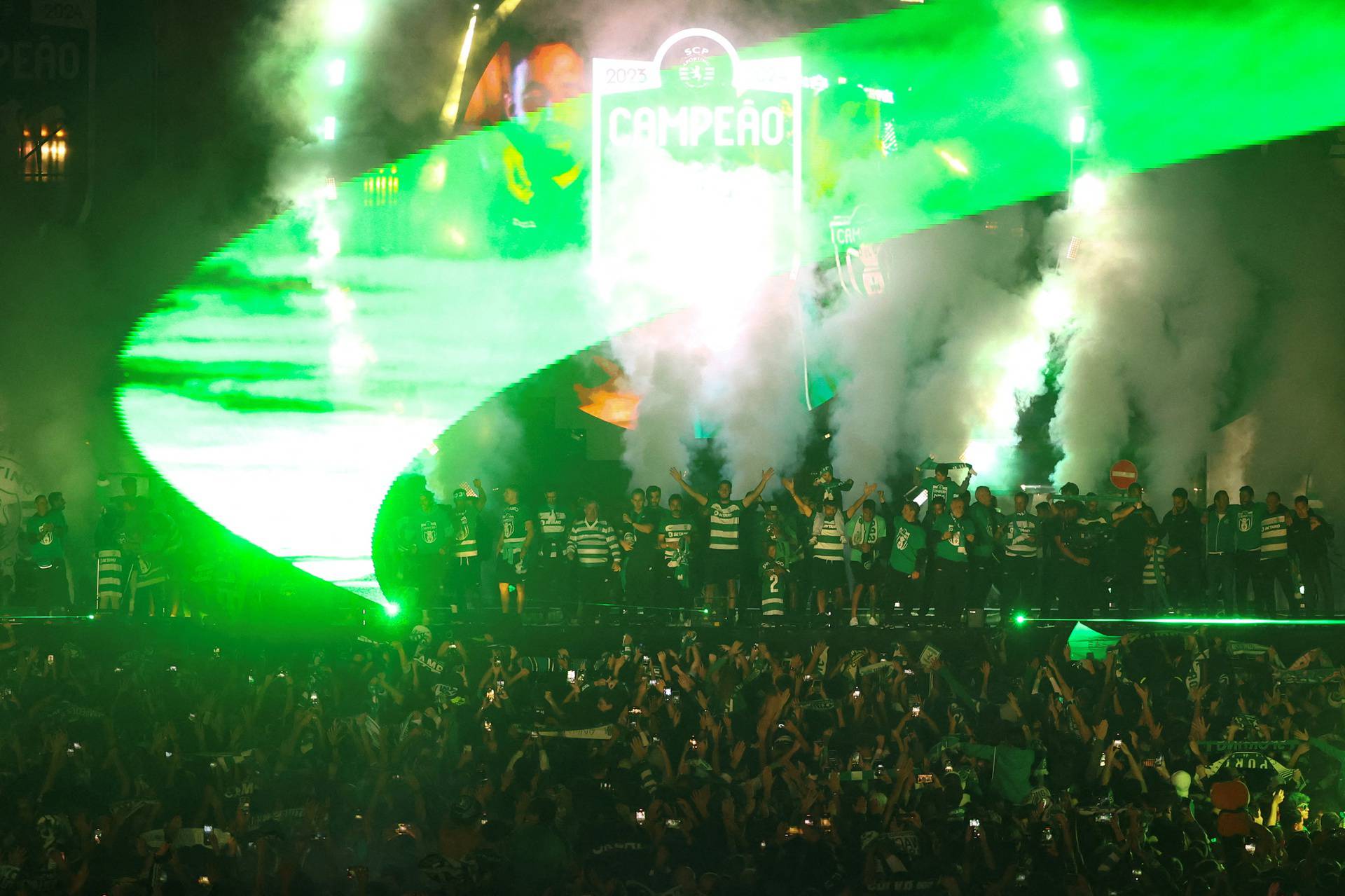 Sporting CP team celebrates with their supporters after winning the Portuguese League