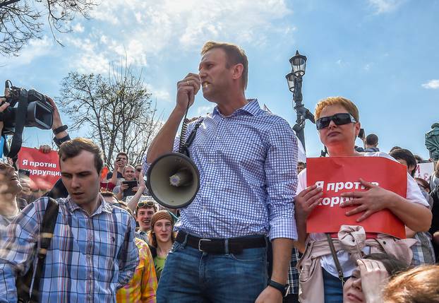 Russian opposition leader Alexei Navalny attends a protest rally ahead of President Vladimir Putin