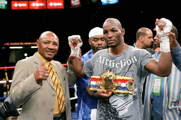 FILE PHOTO: Boxer Marvelous Marvin Hagler  poses with Bernard Hopkins, of Philadelphia, following their light heavyweight fight at the Mandalay Bay Events Center in Las Vegas