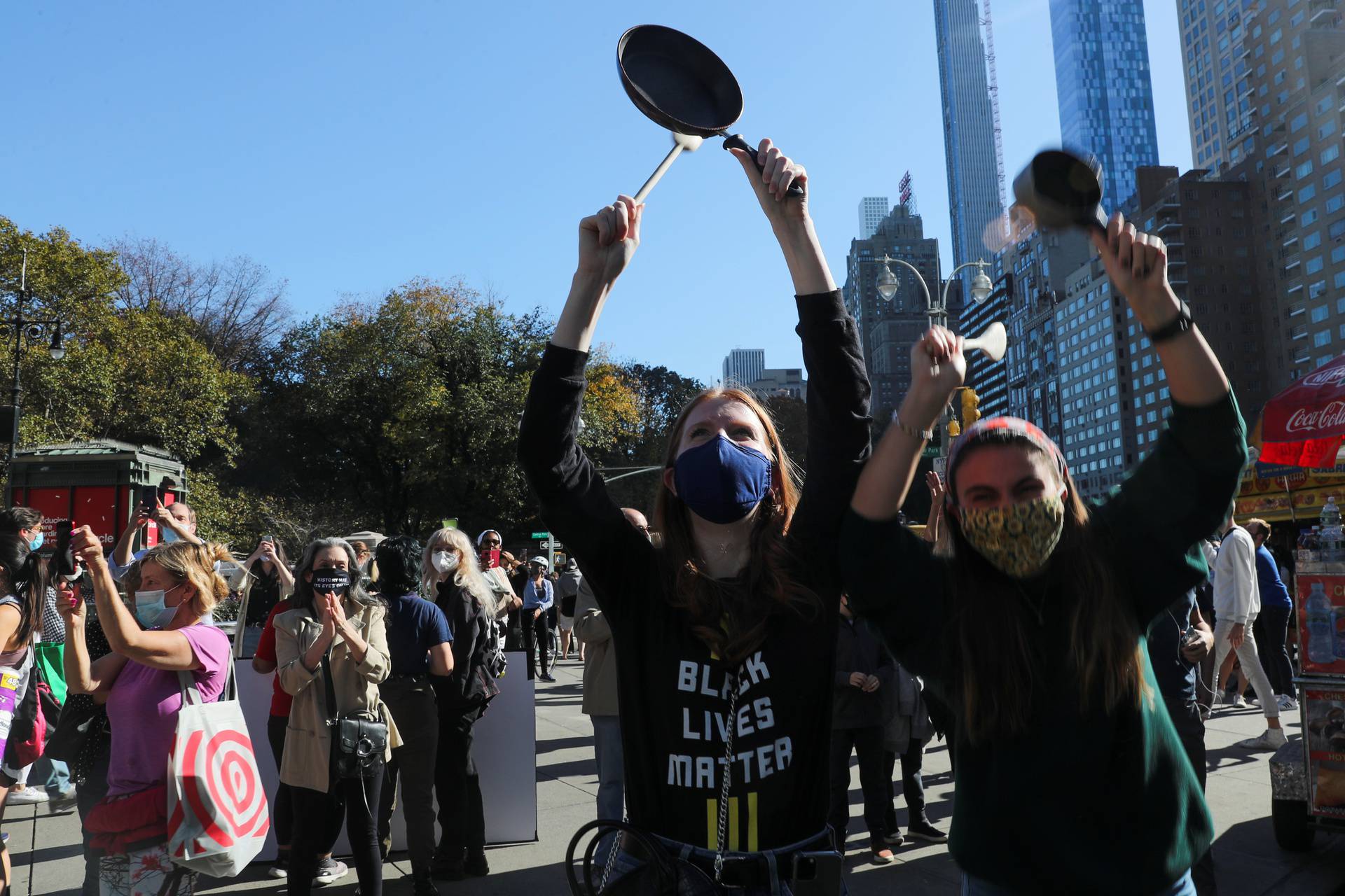 People celebrate media announcing that Democratic U.S. presidential nominee Joe Biden has won the 2020 U.S. presidential election