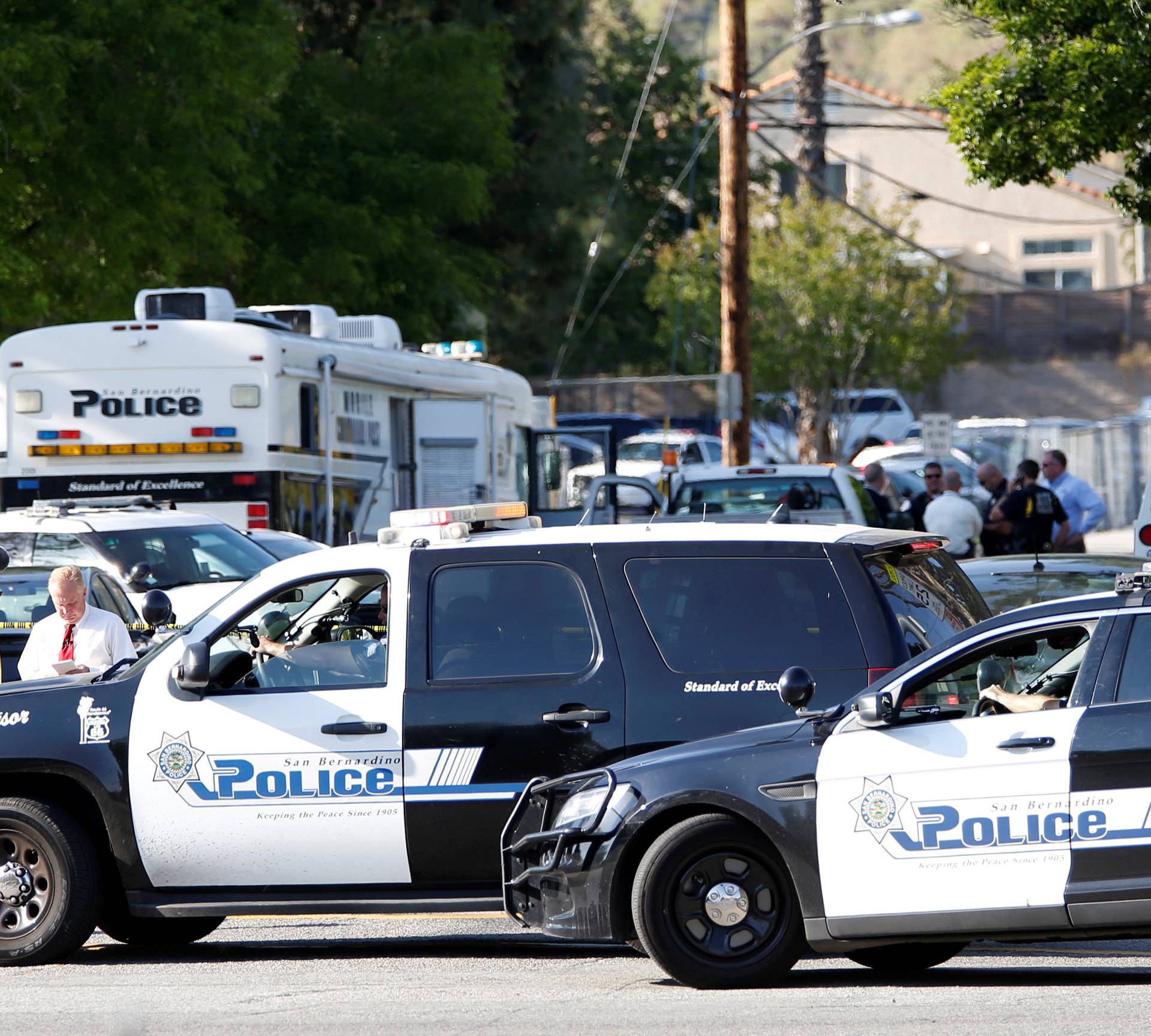 Police vehicles are pictured after a shooting at North Park Elementary School in San Bernardino
