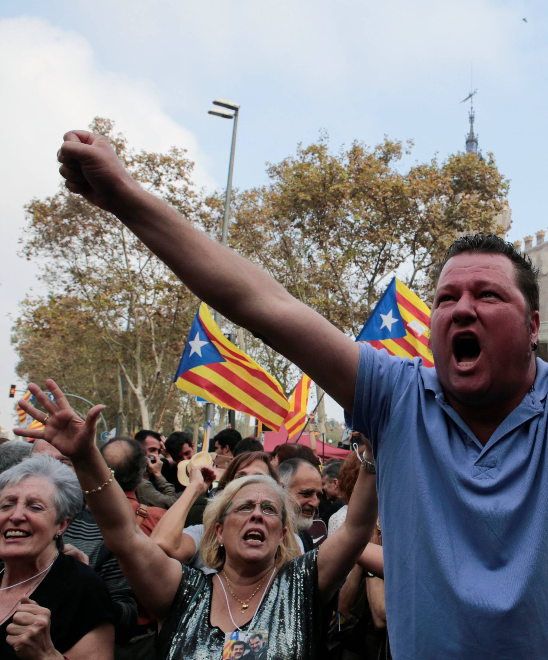 People celebrate after the Catalan regional parliament declares independence from Spain in Barcelona