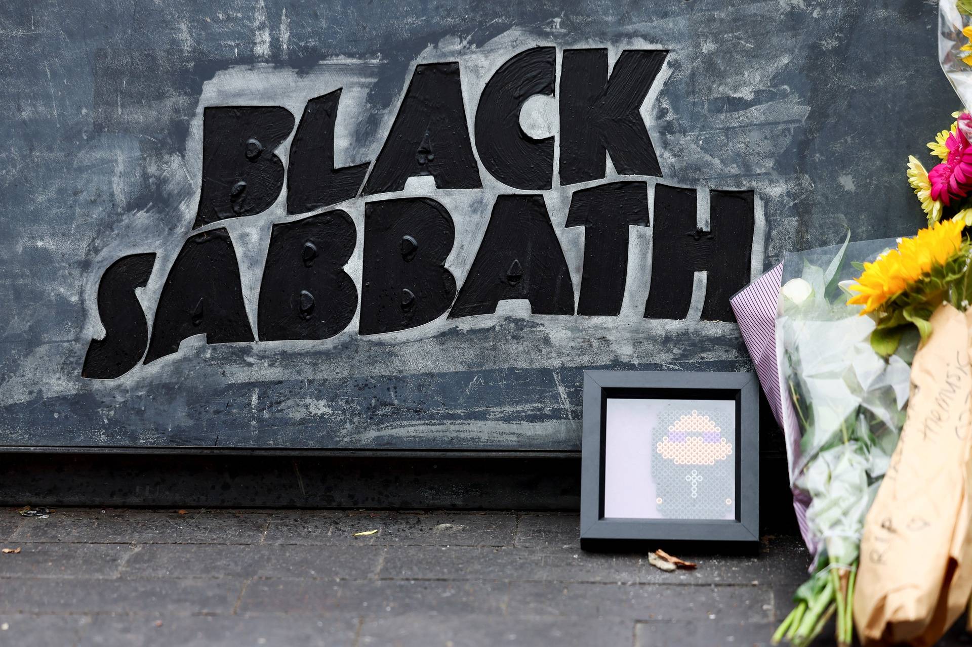 Fans pay tribute following the death of Ozzy Osbourne, in Birmingham