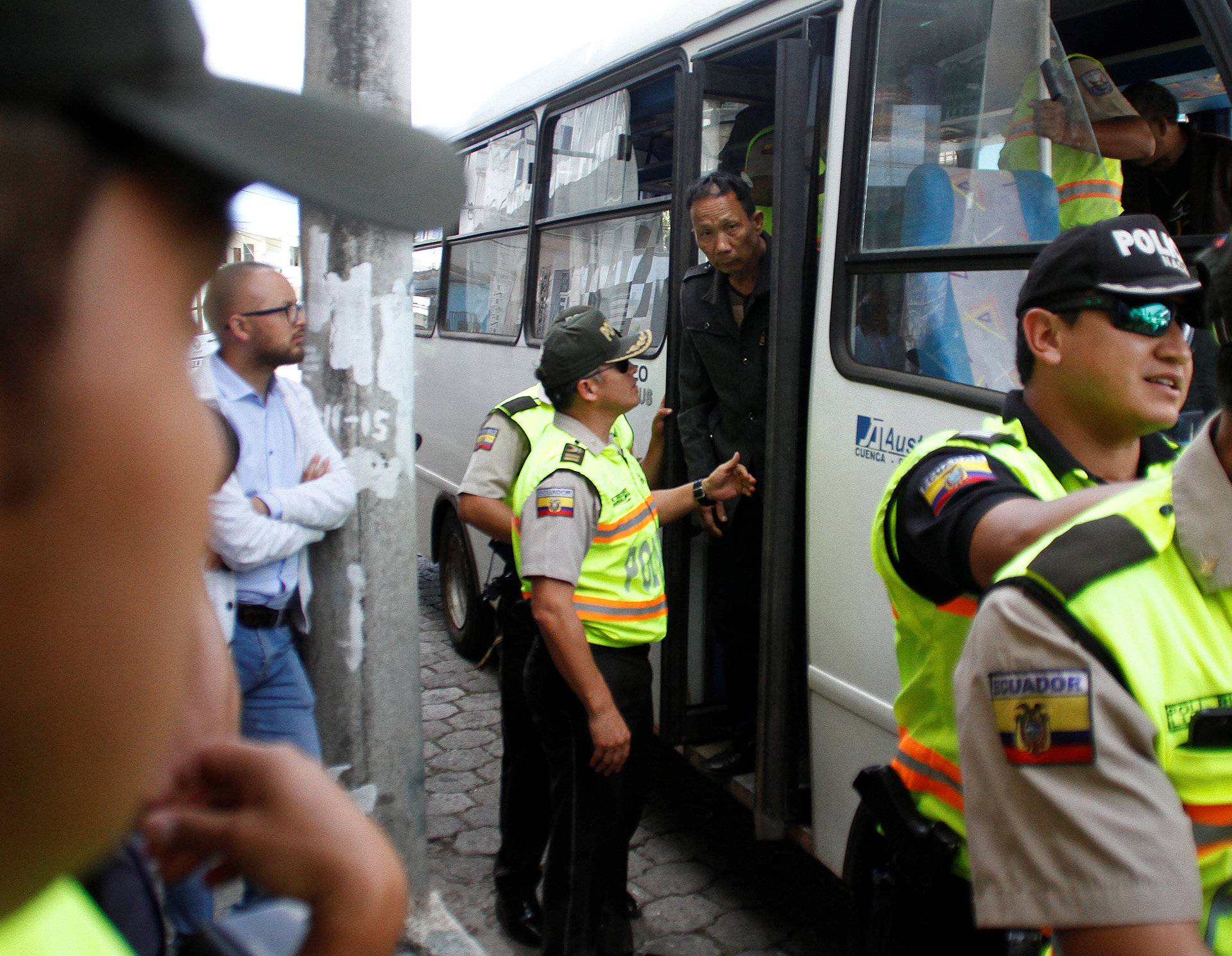 A Chinese crew member steps off a bus after being detained along with others for illegally fishing off the Galapagos Islands, in Puerto Baquerizo Moreno