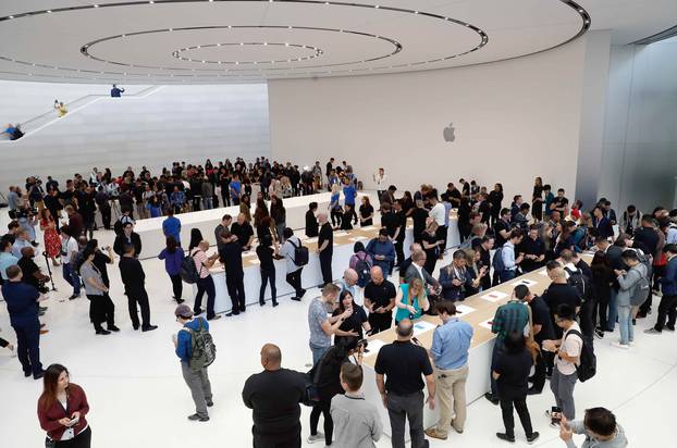 A demonstration of the newly released Apple products is seen following the product launch event in Cupertino