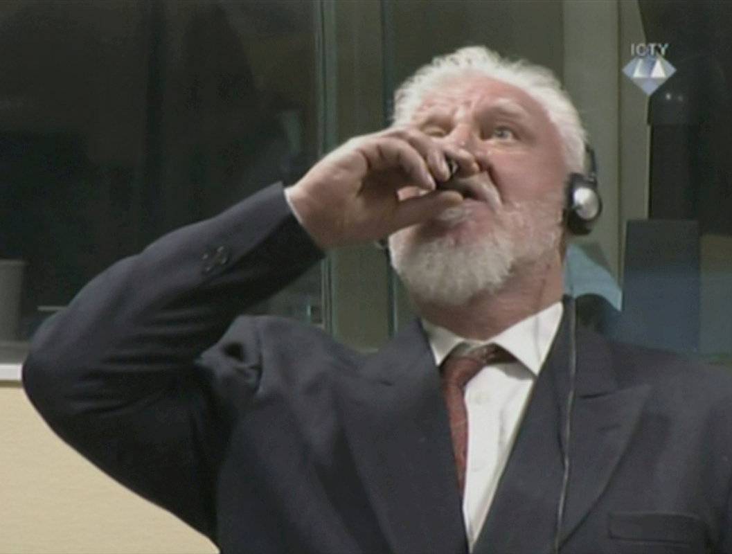 A wartime commander of Bosnian Croat forces, Slobodan Praljak, is seen during a hearing at the U.N. war crimes tribunal in the Hague
