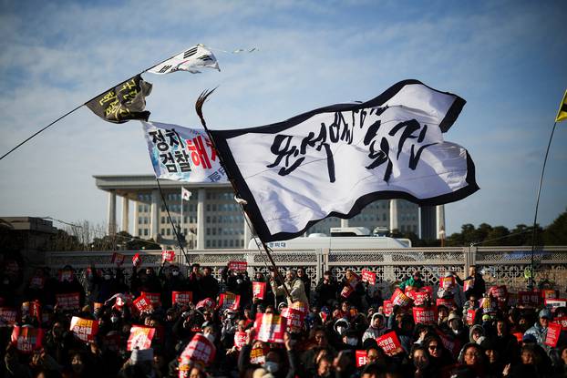 Protesters take part in a rally calling for the impeachment of South Korean President Yeol, in Seoul